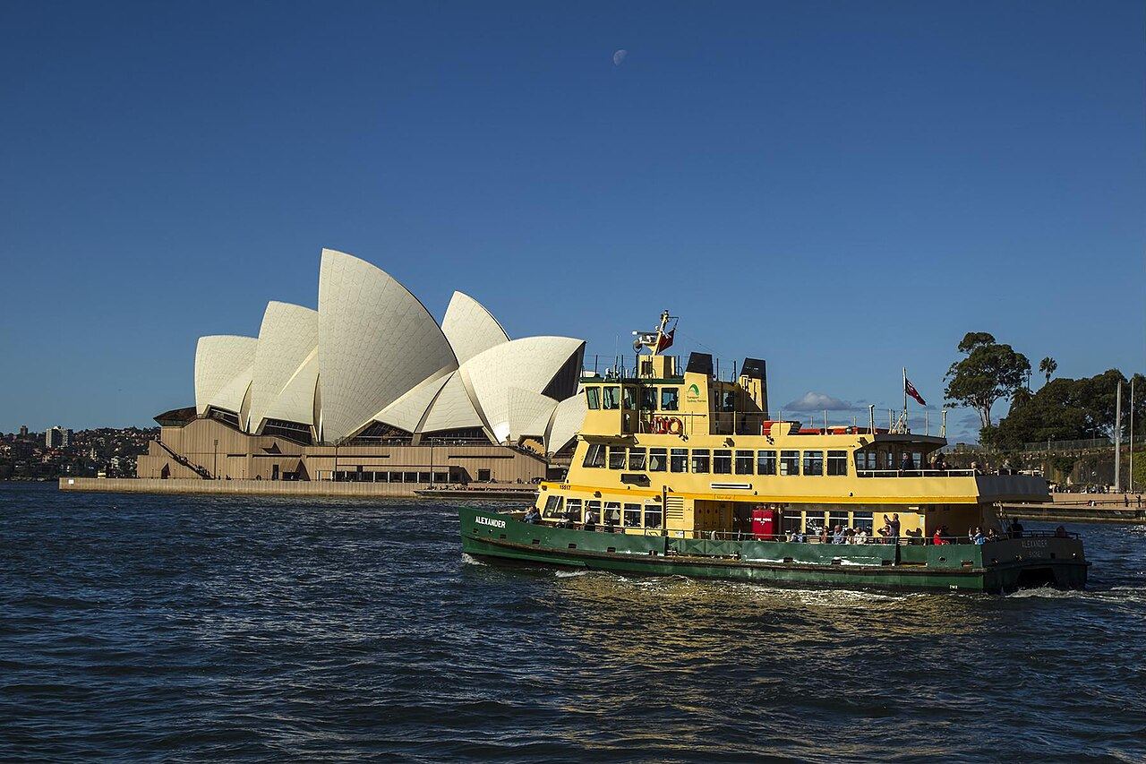 Passengers aboard a Sydney Harbour ferry under way