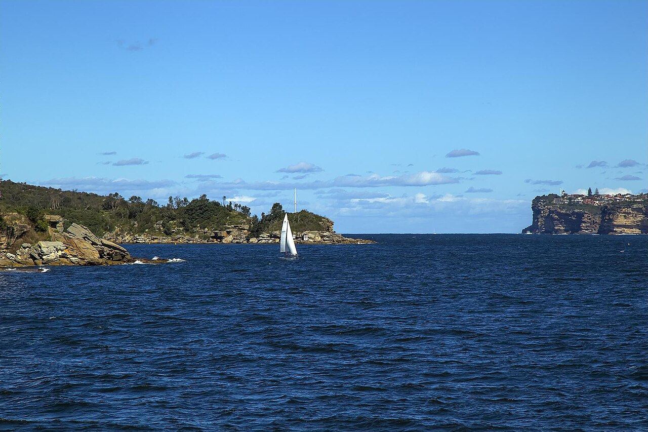 Sailing yacht approaching the harbour heads on passage